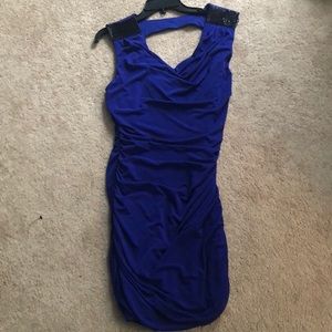 Blue tight dress with open back and black studs